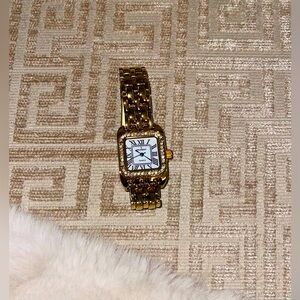 Peugeot watch gold tone, crystal bezel